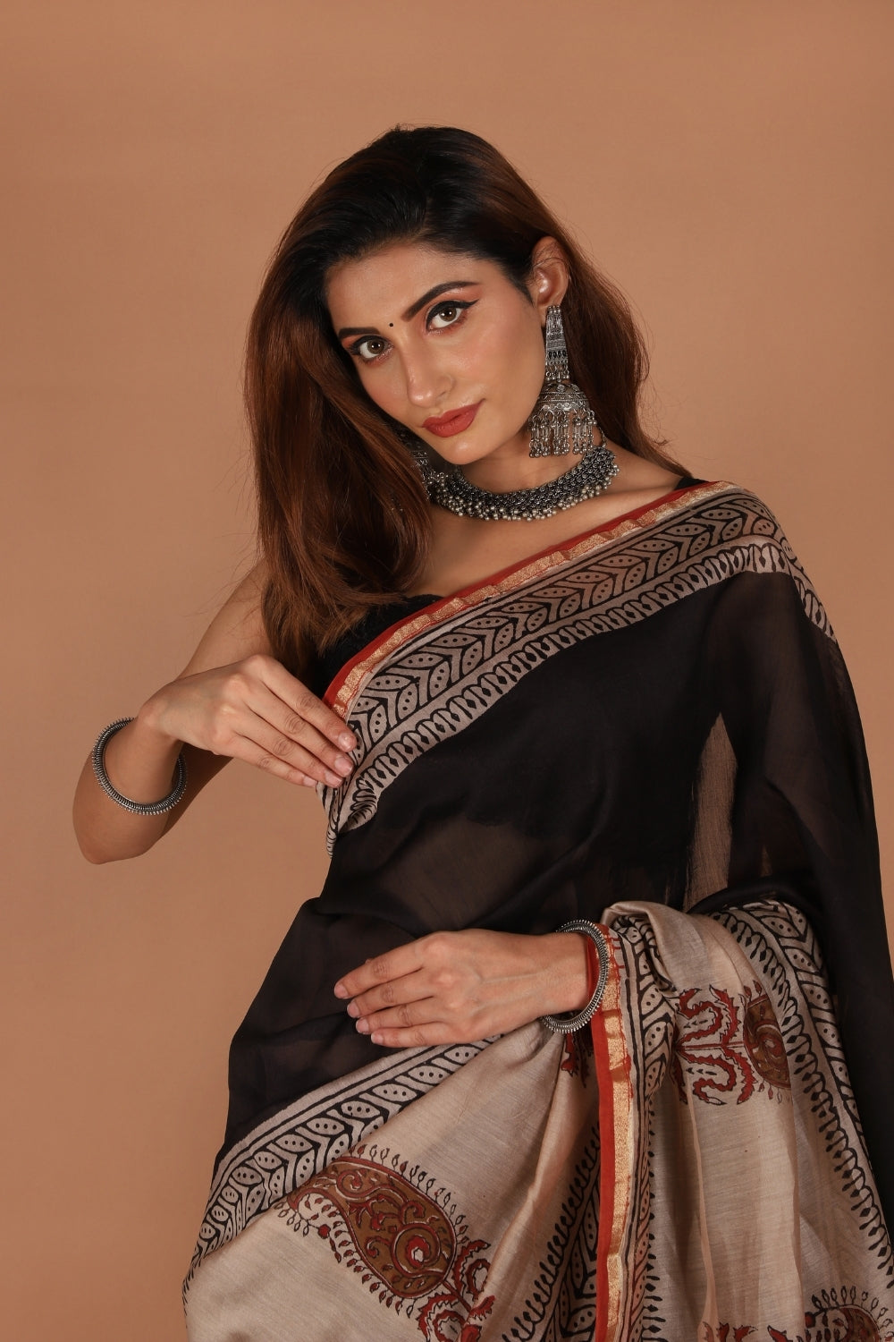 Hand block printed black and beige Chanderi saree with paisley motifs