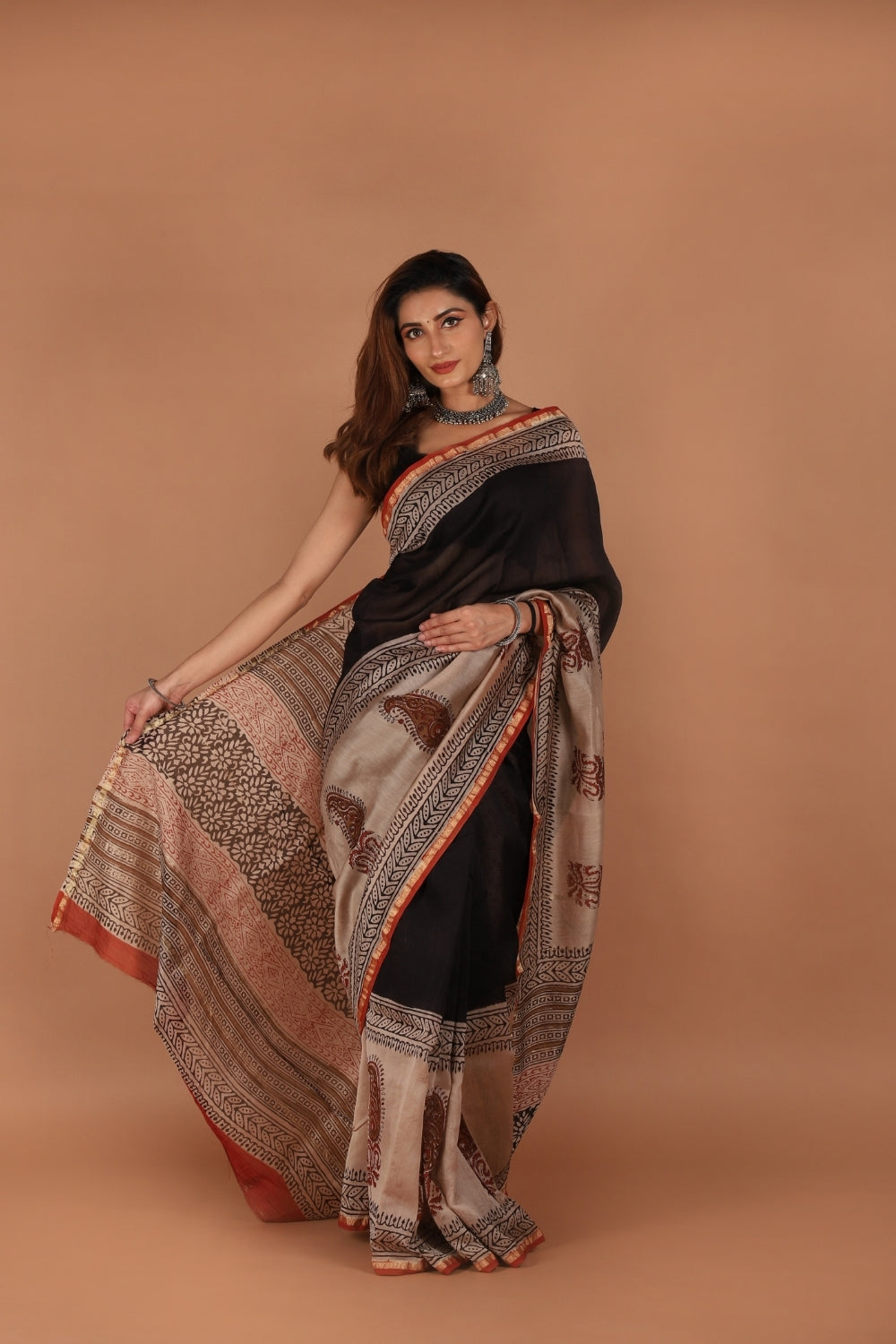 Hand block printed black and beige Chanderi saree with paisley motifs