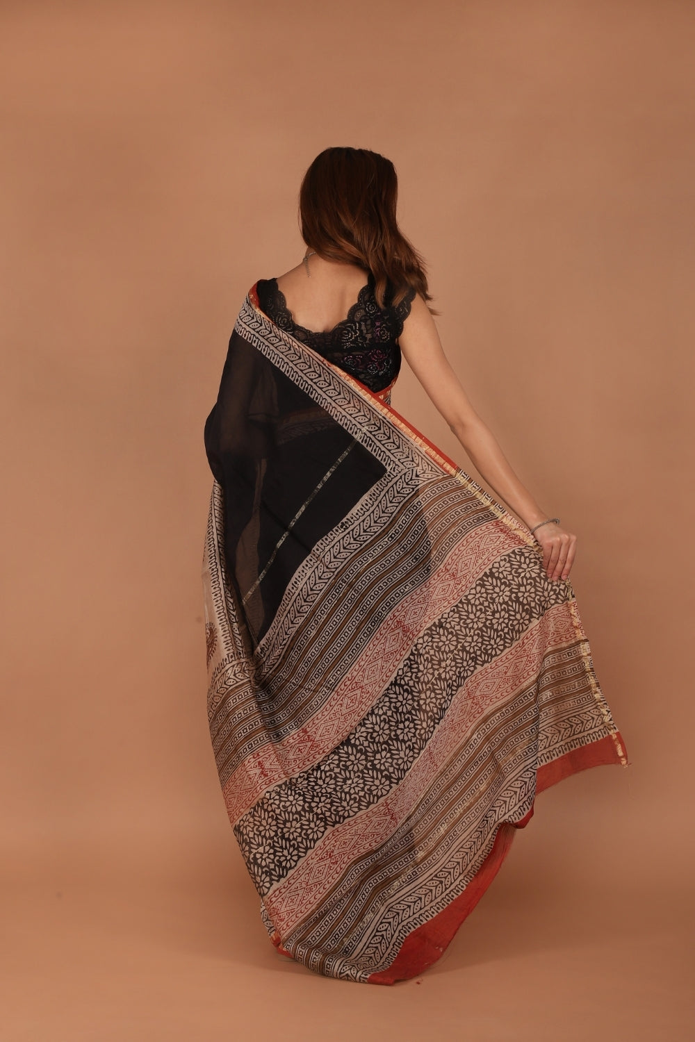 Hand block printed black and beige Chanderi saree with paisley motifs