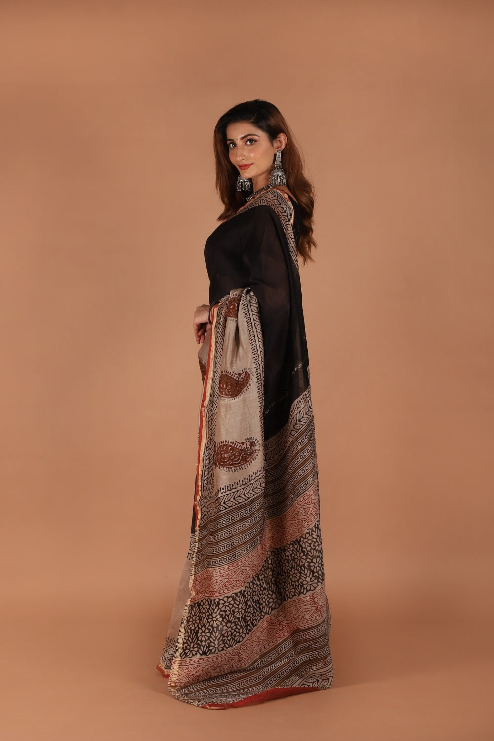 Hand block printed black and beige Chanderi saree with paisley motifs