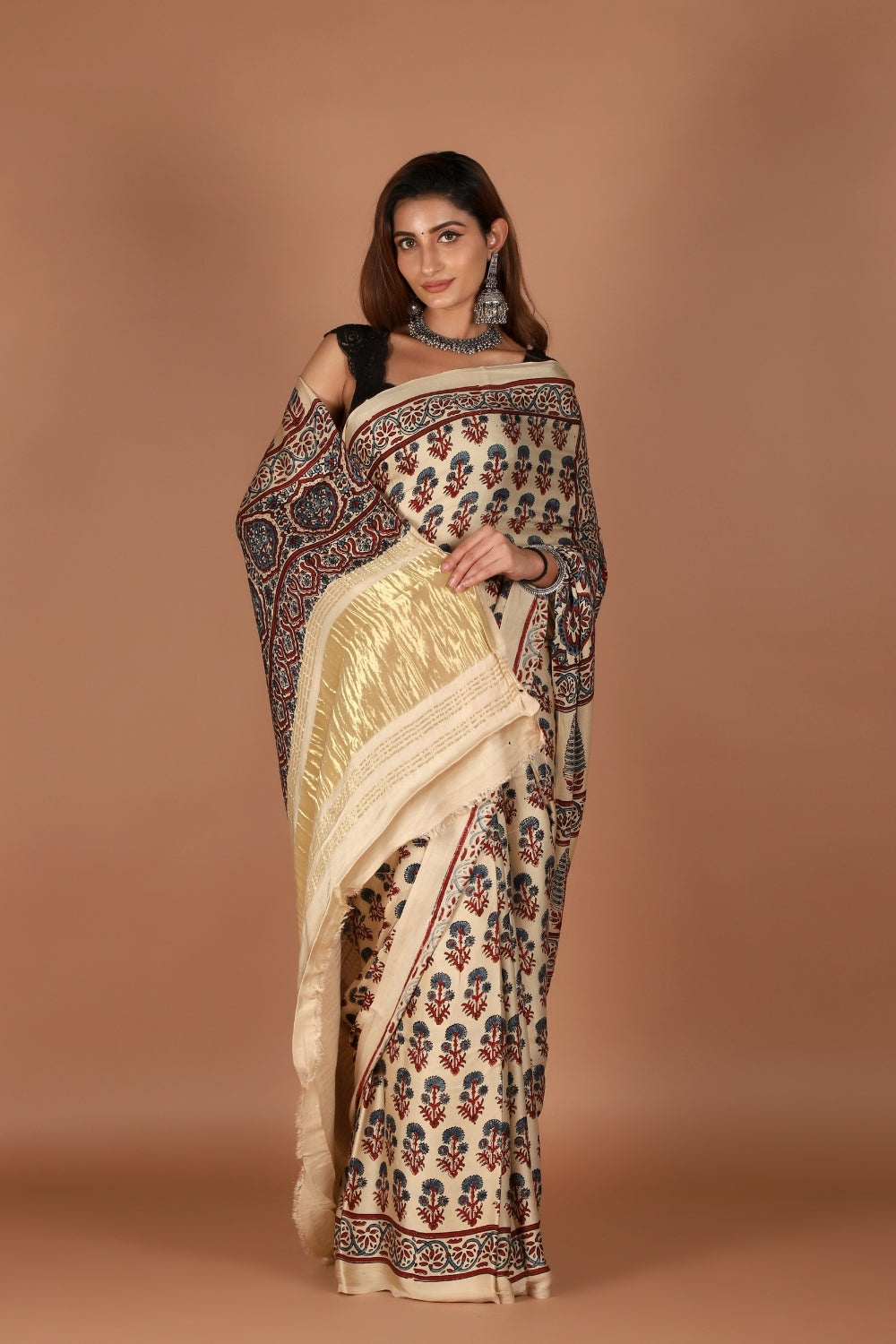 Model wearing modal silk saree with Ajrakh print and zari palla