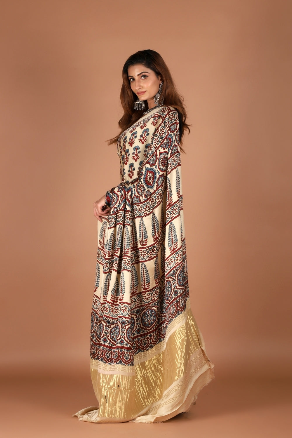 Model wearing modal silk saree with Ajrakh print and zari palla