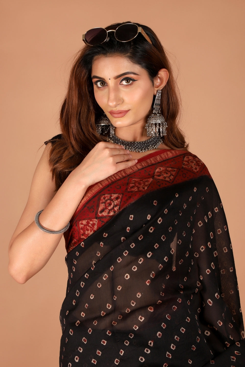 Black and maroon hand block printed Chanderi silk saree styled with sunglasses