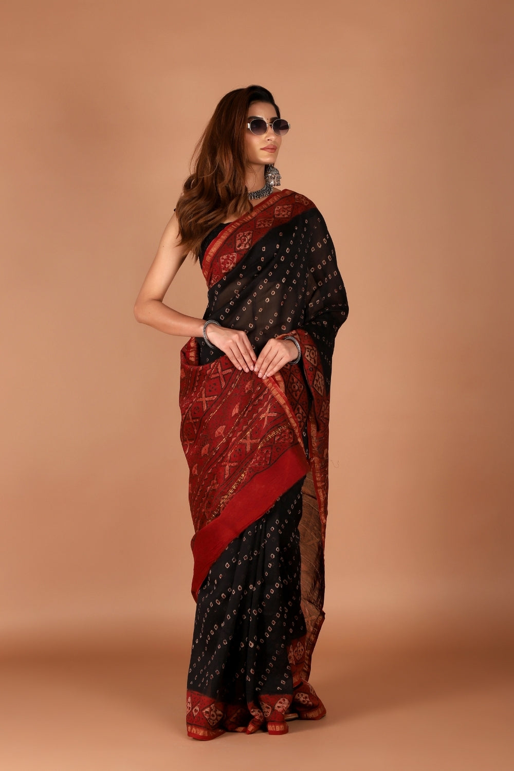 Black and maroon hand block printed Chanderi silk saree styled with sunglasses