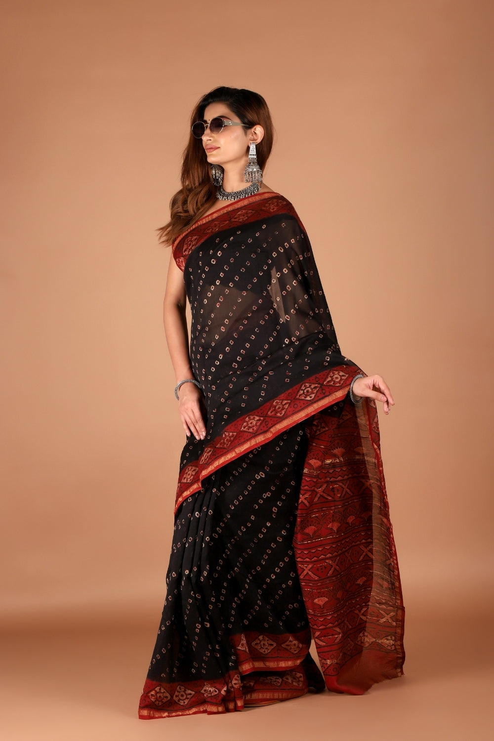 Black and maroon hand block printed Chanderi silk saree styled with sunglasses