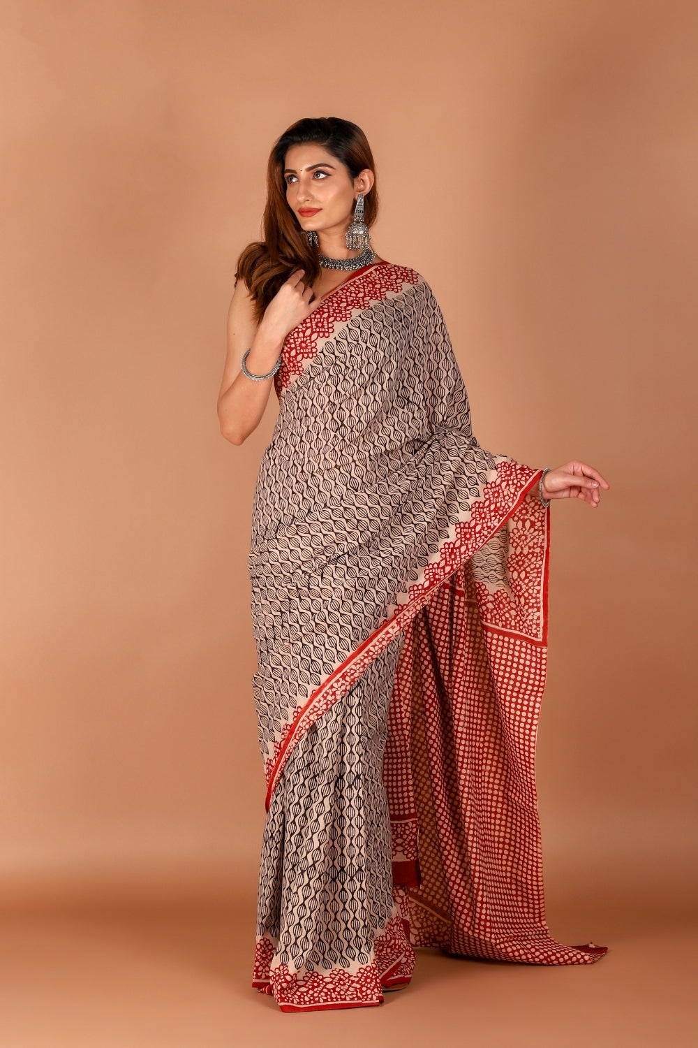 Model wearing red and beige hand block printed mull cotton saree