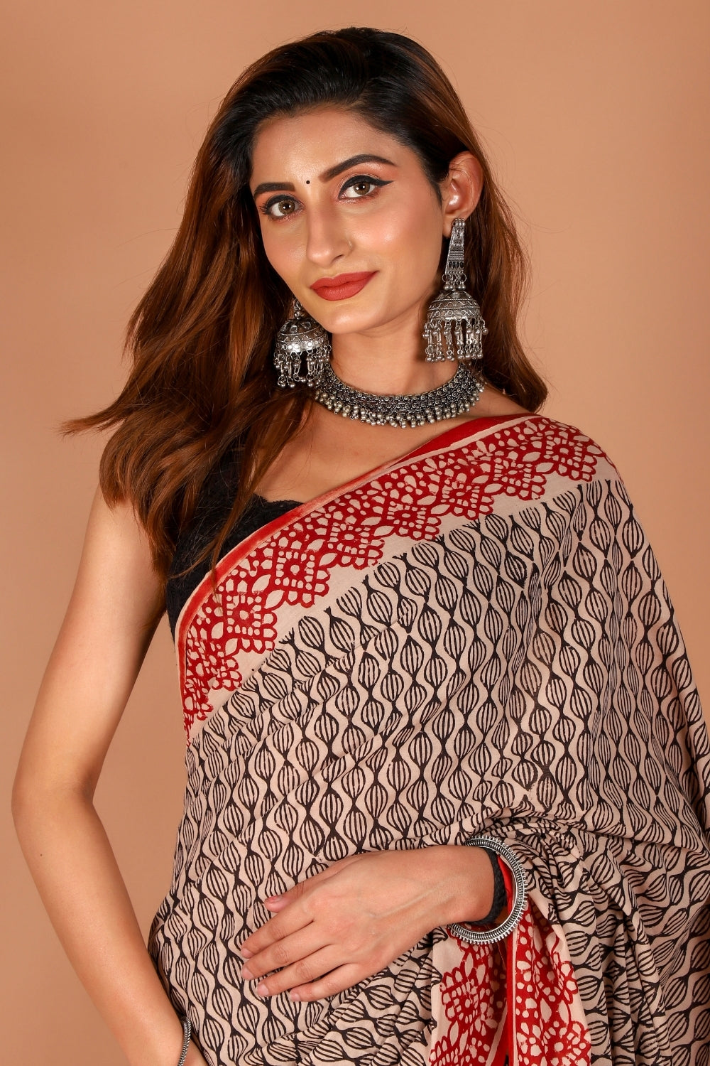 Model wearing red and beige hand block printed mull cotton saree