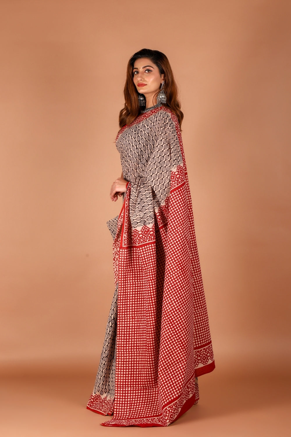 Model wearing red and beige hand block printed mull cotton saree