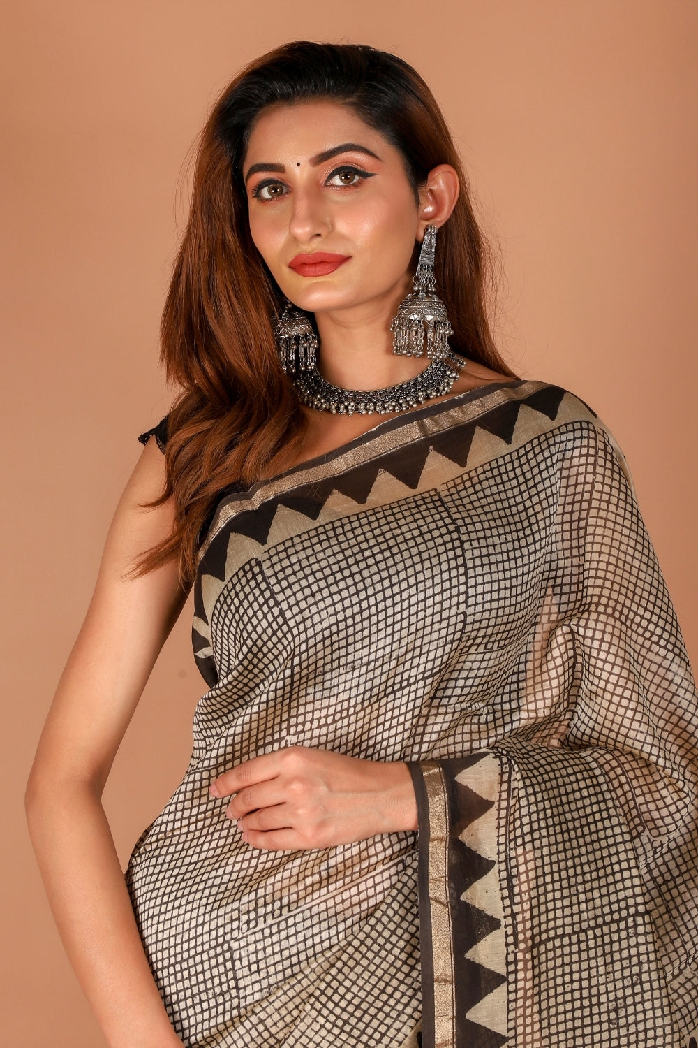 Model wearing hand block printed Chanderi silk saree with lotus motif border