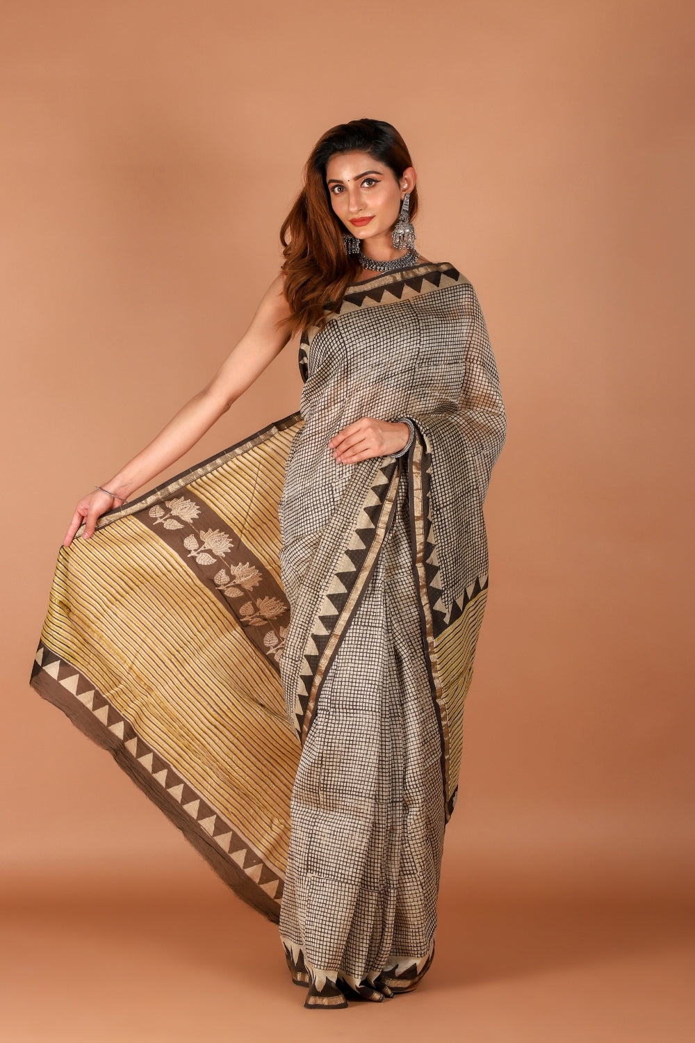 Model wearing hand block printed Chanderi silk saree with lotus motif border
