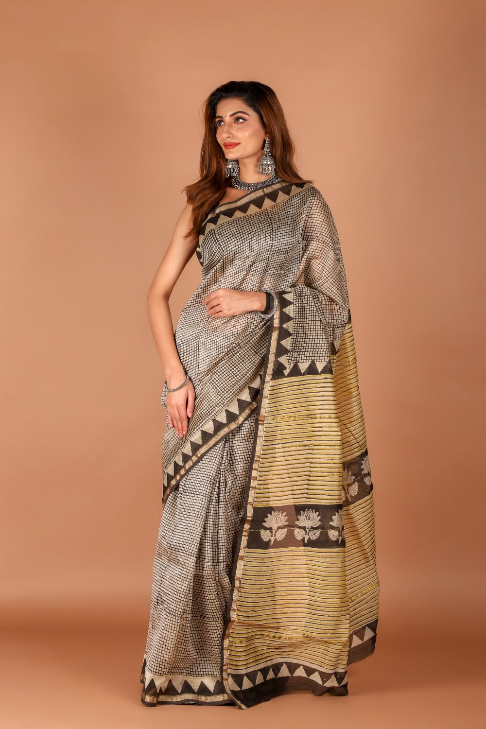 Model wearing hand block printed Chanderi silk saree with lotus motif border
