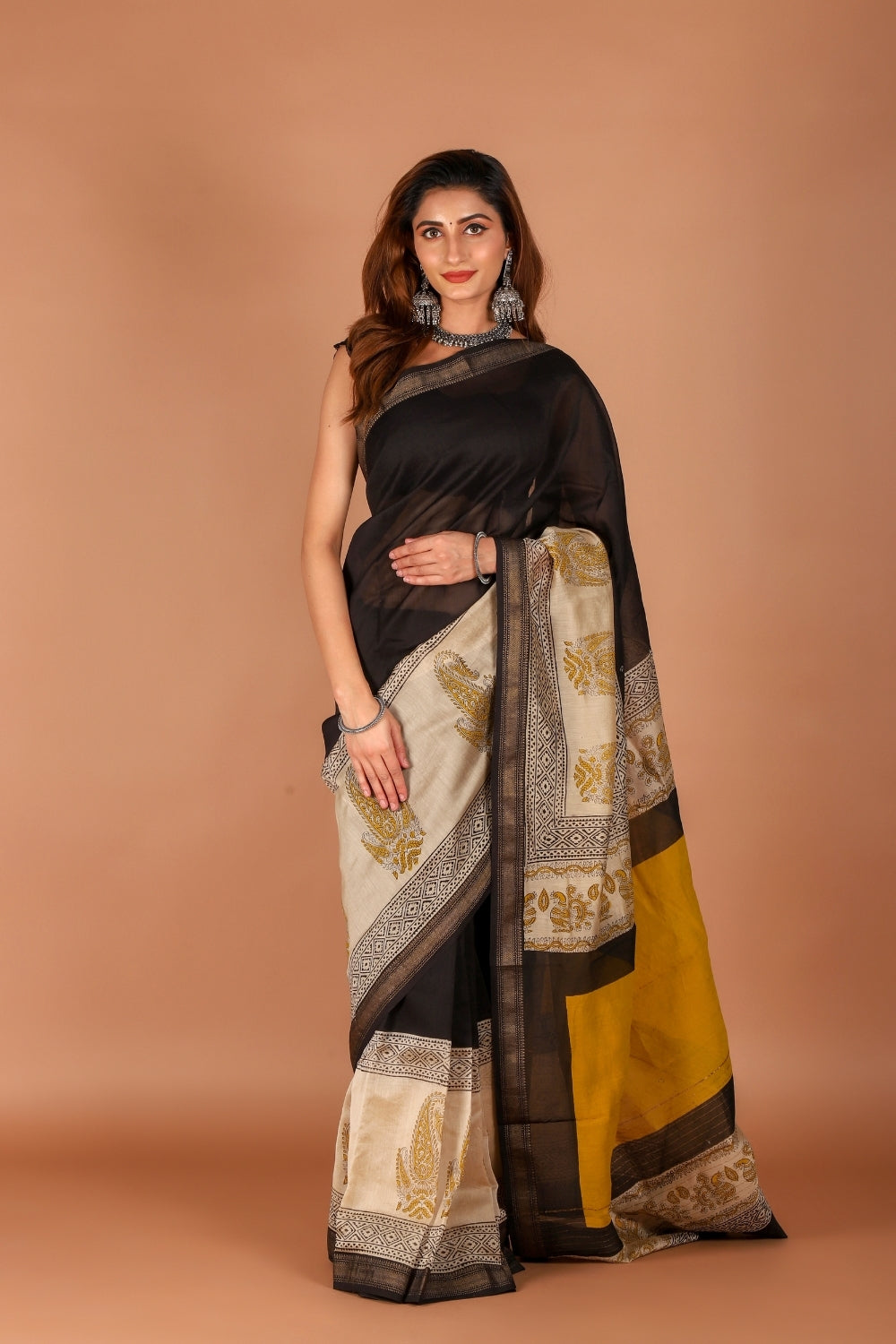 Model in black Chanderi saree with beige hand block print details