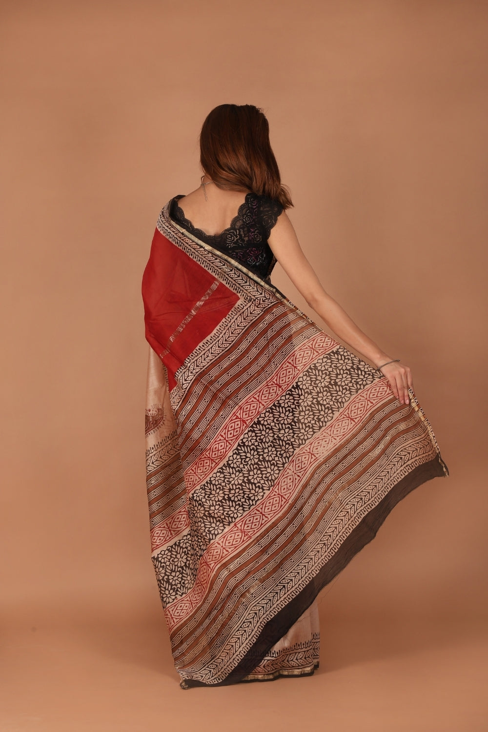 Model showcasing classic ivory Chanderi silk saree with intricate hand block prints